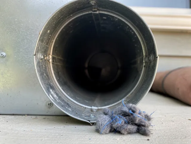 Seal Beach Dryer Vent Cleaning technician using specialized equipment to clear severe dryer vent blockage in Seal Beach